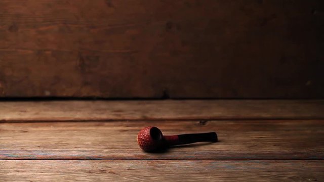 Hat hand smoking pipe black piano horse figure clapper board woods hd footage 