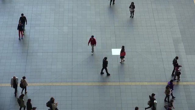 Chaotic movement of people on the tiled square, Timelapse. Japan