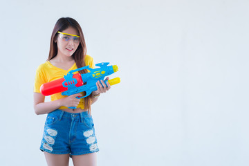 Asian sexy woman with water in hand on white background,Festival songkran day at thailand,The best of festival of thai,Land of smile