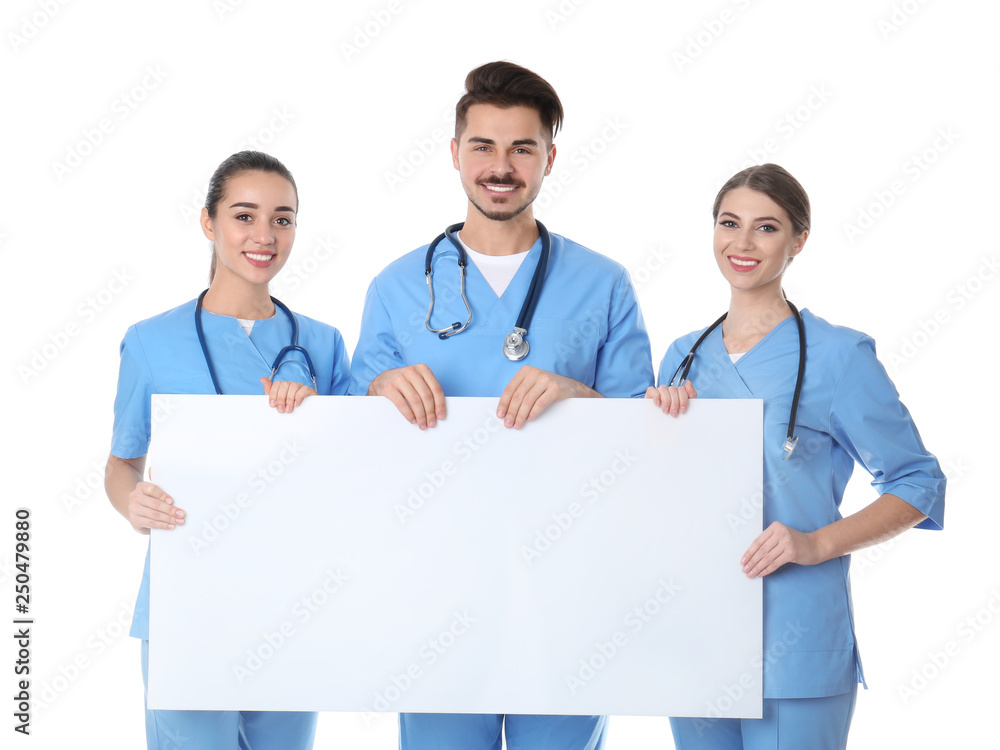 Canvas Prints Medical students with blank poster on white background