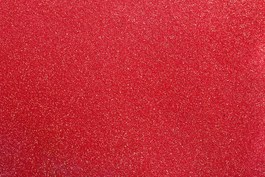 Closeup view of sparkling red glitter background