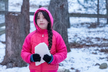 Young Asian Girl with pink jacket with hood