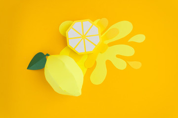 Fruit made of paper. Yellow background. There's room for writing. Tropics. Flat lay. Lemon.