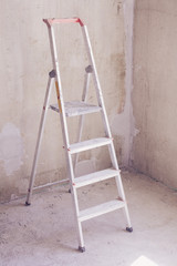 Room with ladder and wall background