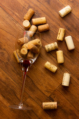Fototapeta na wymiar wine cork wine glass on wooden background