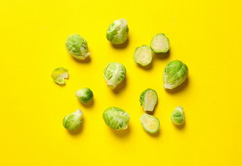 Fresh Brussels sprouts on color background, flat lay