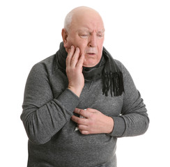 Senior man suffering from cough on white background