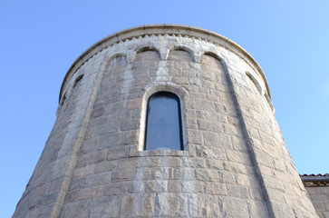 Isolated castle gothic church stone faced exterior. Intricate architectural detail and design. Stone faced building facade exterior.