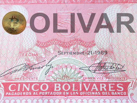 macro extreme close-up image of bolivia currency bolivar with golden bitcoin instead of a letter b at country name