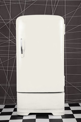 old vintage white refrigerator on a deep background