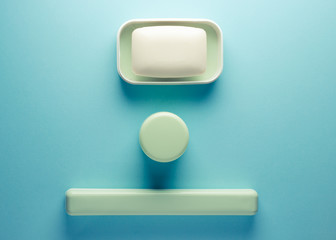 soap and tooth brush on a colored background
