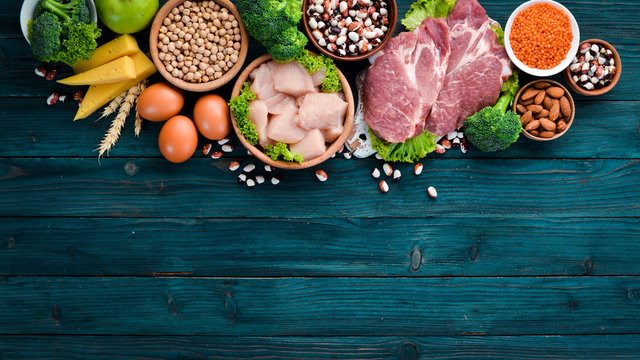 Balanced diet food background. Protein foods On a blue wooden background. Free space for your text.
