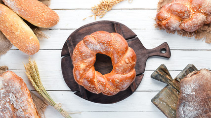 Round braided loaf of bread flour. Top view. Free space for your text.