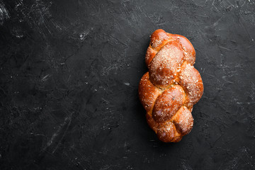 Braided bread with flour. Top view. Free space for your text.