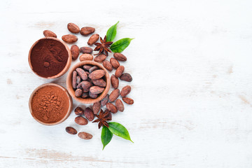 Cocoa beans, cocoa powder is dark and light. On a white background. Top view.