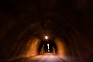 Obraz na płótnie Canvas Almannaskardsgong or Almannaskard tunnel inside abstract view near Hofn, Iceland with lights lamp path illuminated blurry blurred in dark passage road highway