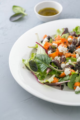 Baked beet and carrot salad with cheese. close up, selective focus
