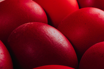 eggs colored with natural dye on brown dish