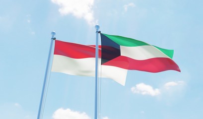Kuwait and Indonesia, two flags waving against blue sky. 3d image
