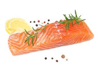 Red fish. Raw salmon fillet with rosemary and lemon isolate on white background.