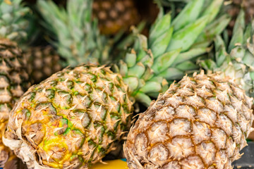 pineapples in a basket in a supermarket