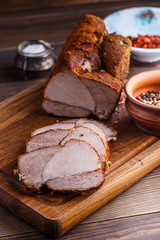 veal roll on wooden board