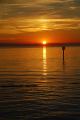 Obraz premium Lindau, Germany: A view of the Bodensee (aka Lake Constance), in the distance Austria, and Switzerland, at sunset in the summer