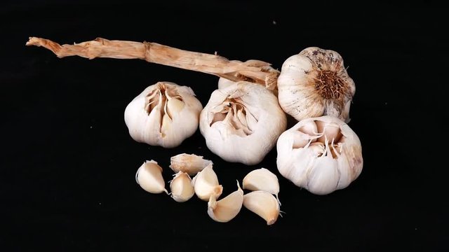 close-up of garlic on black ground,