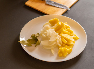 housekeeper prepares products for the soup and puts them on the plate