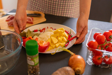 housekeeper prepares products for meat dishes