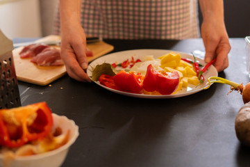 housekeeper prepares products for meat dishes