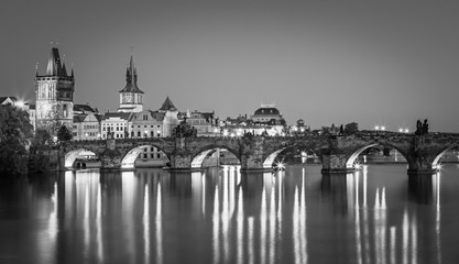 Fototapeta na wymiar Scenic view on Vltava rive, Charles bridge and historical center of Prague, buildings and landmarks of old town at sunset, Prague, Czech Republic