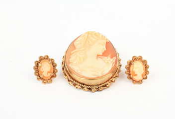 Antique cameo brooch set in gold with matching earrings