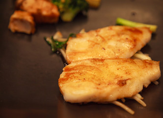 Fresh Assorted Seafood, Snow Fish, Salmon Fillet and Vegetable Teppanyaki Grill (Japanese cuisine that uses iron griddle or hot fry pan to cook food) in traditional steakhouse. Food Cooking concept