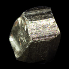 Natural piece of pyrite cube on a black background