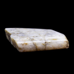 Natural piece of belomorite on black background