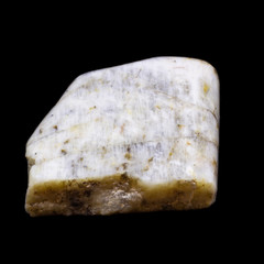 Natural piece of belomorite on black background