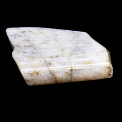 Natural piece of belomorite on black background