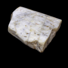 Natural piece of belomorite on black background