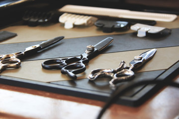 Three scissors on table