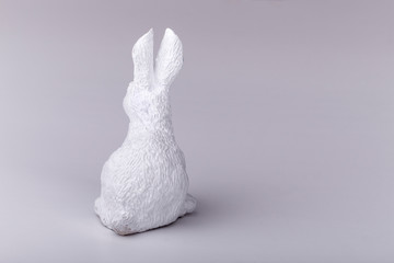 white Easter bunny from the back, the concept of the end of Easter holidays