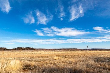 Old Route 66 running through the New Mexico countryside, on a sunny winters day