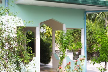 Typical maldivian house with a garden and decorative plants (Ari Atoll, Maldives)