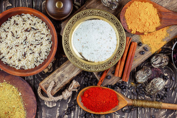 Fototapeta na wymiar Spices and seasonings for cooking in the composition on the table