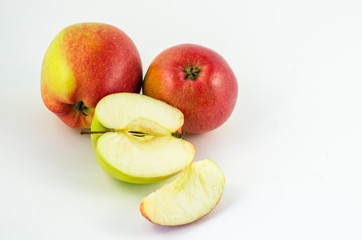 Apples on a white background, juicy red fruits. Useful fruit for a healthy diet.