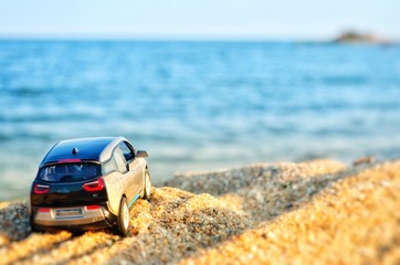 Fototapeta na wymiar Car model on the beach.