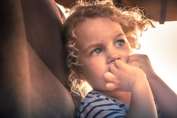 Scared child worry emotion portrait facial expression symbolizing worry and scare expression