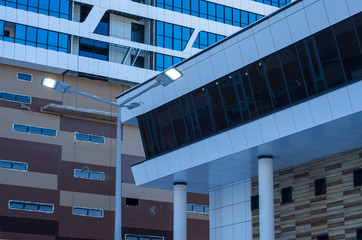 Facing the building with a ventilated facade. Aluminum colored facades. Modern facades of high-rise...