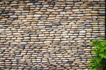 Beautiful River Pebble Wall Background. Seamless pebble stone floor and wall pattern arranged for texture wallpaper.