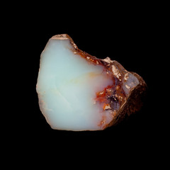 Natural piece of blue opal on a black background